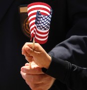 Veteran and Boy holding American Flag